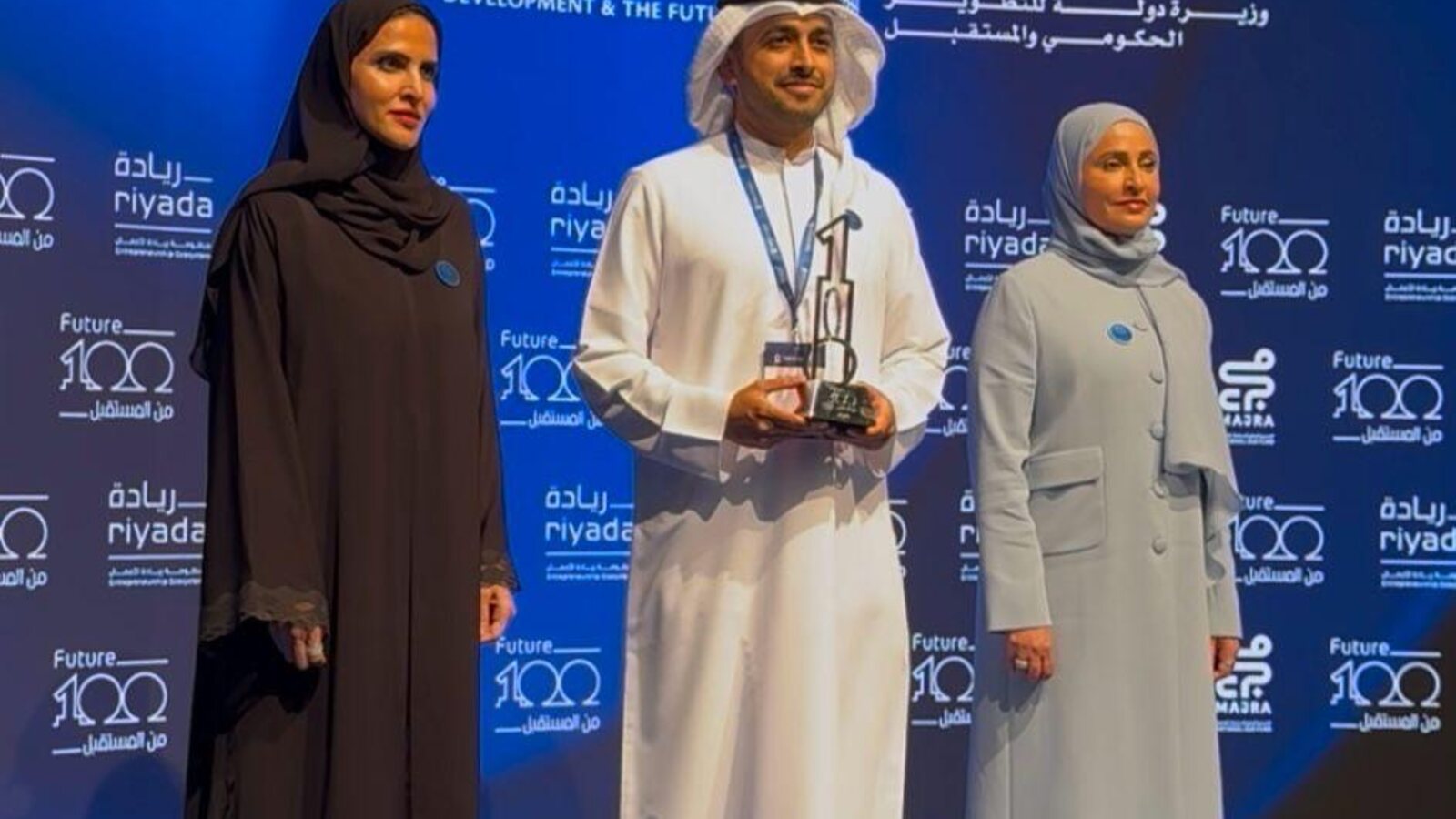 Award moment on stage at a UAE event